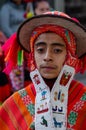 Caraz, Peru, July 19, 2014: Closed portrait of young ethnic boy dressed in typical Inca costume with hat and fabric embroidery in