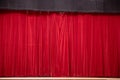 Closed red curtains in a theater scene. Royalty Free Stock Photo