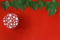 Closed red round gift box on red background. Royalty Free Stock Photo