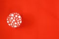 Closed red round gift box on red background. Royalty Free Stock Photo