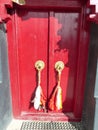 Closed red wood door of an ancient monastery to Leh in Ladakh, India. Royalty Free Stock Photo