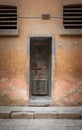 Closed rusted iron cell door and weathered grunge stone wall in closed abandoned prison, Cairo Citadel, Egypt Royalty Free Stock Photo