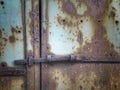 Closed rusty metal door with lock Royalty Free Stock Photo