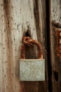 Closed rusty on an wooden door