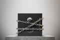 Closed safe box, chain, white wall Royalty Free Stock Photo