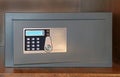 Closed safe on hotel shelf Royalty Free Stock Photo