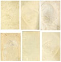 Closed seamless image of a sheet of old yellowed paper with dark brown spots, traces of time.