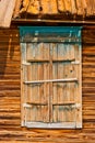 Closed shatters of wooden window made of weathered wood in Astrakhen Russia