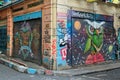 Closed shop exteriors with metal doors painted with colorful graffiti at Hoca Tahsin Street, Karakoy district, Istanbul, Turkey