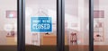 Closed sign hanging outside electronics store shop window coronavirus pandemic quarantine bankruptcy Royalty Free Stock Photo