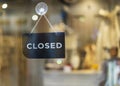 Closed sign hanging outside a restaurant, store, office or other