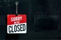 Closed sign in a shop window sorry we are closed Royalty Free Stock Photo