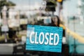 Closed sign on the street cafe door. Closed cafes due to the corona virus pandemic. Royalty Free Stock Photo