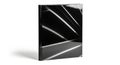 Sleek Black Book with Reflective Light Streaks on White Background journal notebook Royalty Free Stock Photo