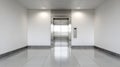 Closed stainless steel elevator doors in a modern building hallway. Royalty Free Stock Photo