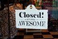 Closed! But Still AWESOME sign in the window of a lady's retail clothing store.