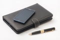 Closed tablet and android mobile phone and gold pen