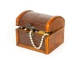 Closed treasure chest with bracelet, coins and pearls