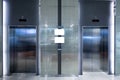 Closed two elevator doors glossy illuminated in hotel