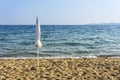 Closed umbrella near by the seashore