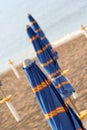 Closed umbrellas on the beach