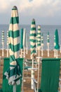 Closed umbrellas on the beach