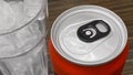 Closed up of Aluminum red soda can with a glass of ice cubes Royalty Free Stock Photo