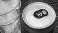 Closed up of Aluminum red soda can with a glass of ice cubes. Black and white tone Royalty Free Stock Photo