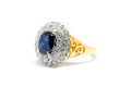 Closed up Blue Sapphire with white diamond and gold ring isolat Royalty Free Stock Photo