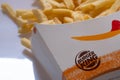 Closed up of Burger King's french fries on white background. Focus on Burger King's logo