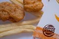 Closed up of Burger King's french fries on white background. Focus on Burger King's logo