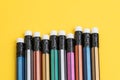 Closed up of colorful pencil with eraser on solid yellow background with copy space using as writing, mistake and correction or Royalty Free Stock Photo