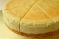 Closed up a delectable creamy yellow color whole baked cheesecake