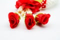 Closed up fabric red rose on Thai plastic garland isolated on white Royalty Free Stock Photo