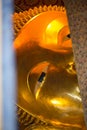 Closed up face from window of Reclining Buddha gold statue. Wat Pho Royalty Free Stock Photo