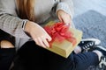Closed up female hands is Tieding ribbon gift box together in Christmas party. Lifstyle of Teenage on holiday and birthday.