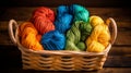 Closed up green, yellow, orange, blue, and back yarn bundle in the wooden basket