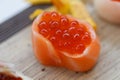 Closed-Up Ikura Salmon Roe Sushi Wraped with Salmon. Royalty Free Stock Photo