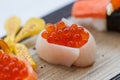 Closed-Up Ikura Salmon Roe Sushi Wraped with Tai Red Seabeam Fish. Royalty Free Stock Photo