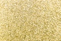 Close up of metallic gold glitter textured background Royalty Free Stock Photo