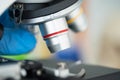 Closed up of microscope in the laboratory with orange light Royalty Free Stock Photo
