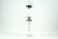 Closed up needle put in vial Royalty Free Stock Photo