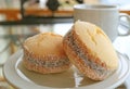 Closed up a pair of Alfajores sweets, traditional Latin American cookies on white plate