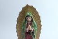 Small Figure Statue of Blessed Virgin Mary in Roman Catholic Church on white background. Royalty Free Stock Photo