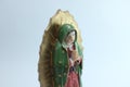 Small Figure Statue of Blessed Virgin Mary in Roman Catholic Church on white background. Royalty Free Stock Photo