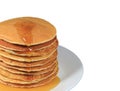 Closed up stack of fresh made pancakes with maple syrup served on white plate, white background with free space for text Royalty Free Stock Photo