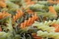 Closed up Texture of Uncooked Tricolor Fusilli, Three-Color Spiral Shaped Pasta Royalty Free Stock Photo