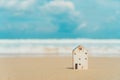 Closed up tiny home model on beach.