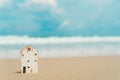 Closed up tiny home model on beach.