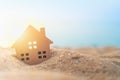 Closed up tiny home model on sand. Royalty Free Stock Photo